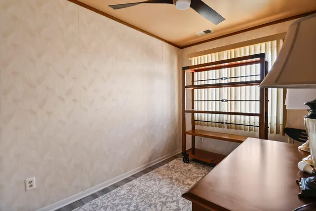 a view of a hallway with windows