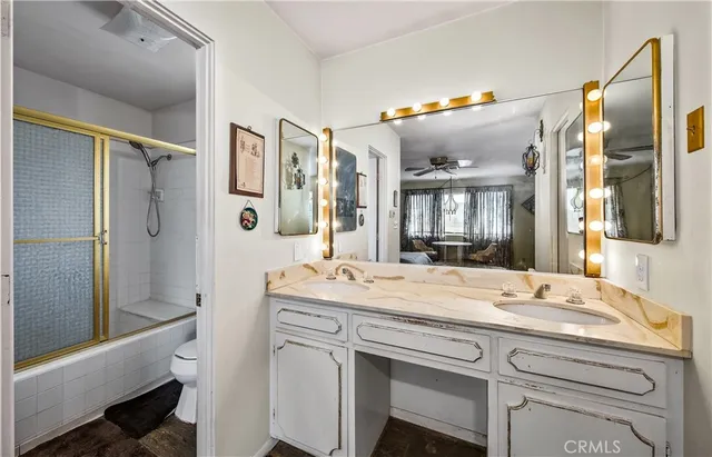 a bathroom with a sink vanity and a mirror