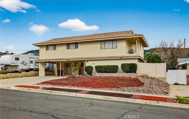 a front view of a house with yard