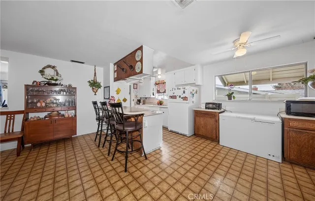 a kitchen with a sink a counter space and appliances
