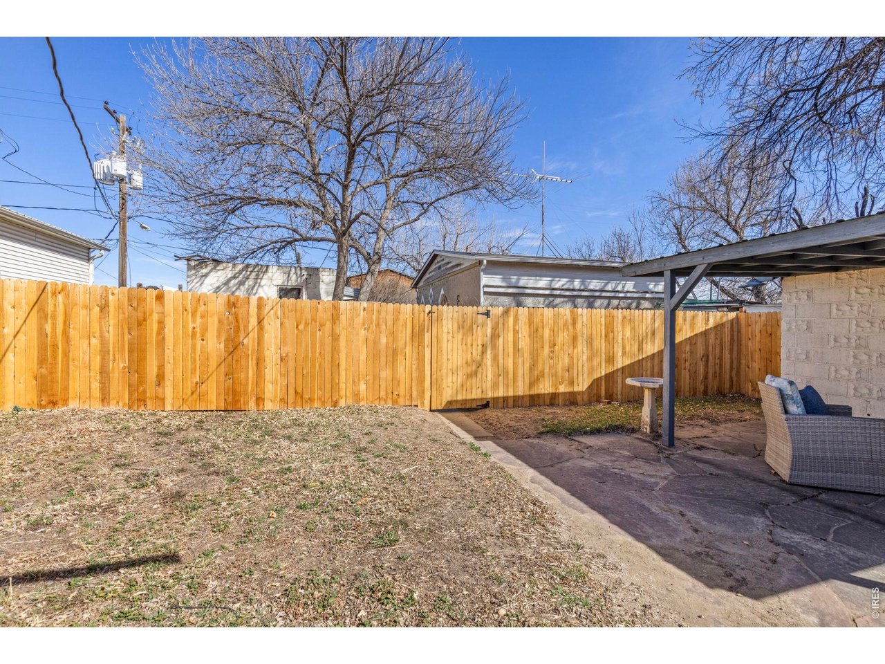 21 North Rutherford Avenue Johnstown, CO 80534 - Photo 29 of 50 The sellers intentionally built a fence between the home and the rentals for additional privacy.