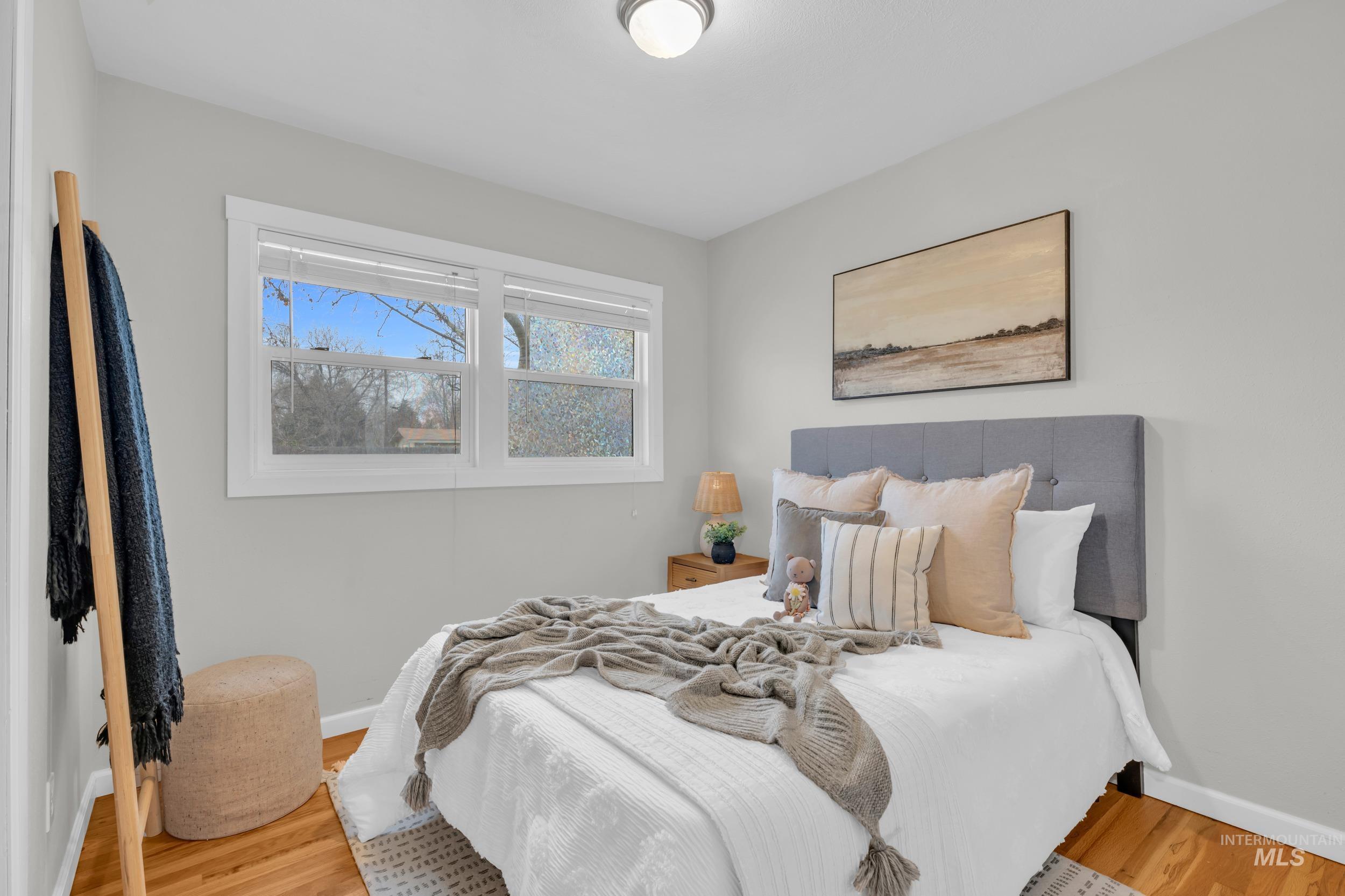 2908 Meadowbrook Drive Boise, ID 83705 - Photo 16 of 29 Bedroom with baseboards and wood finished floors