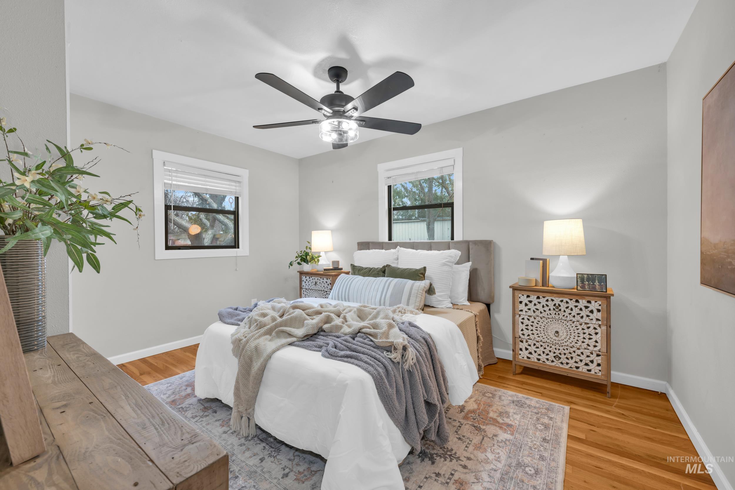 2908 Meadowbrook Drive Boise, ID 83705 - Photo 20 of 29 Bedroom featuring light wood finished floors and ceiling fan