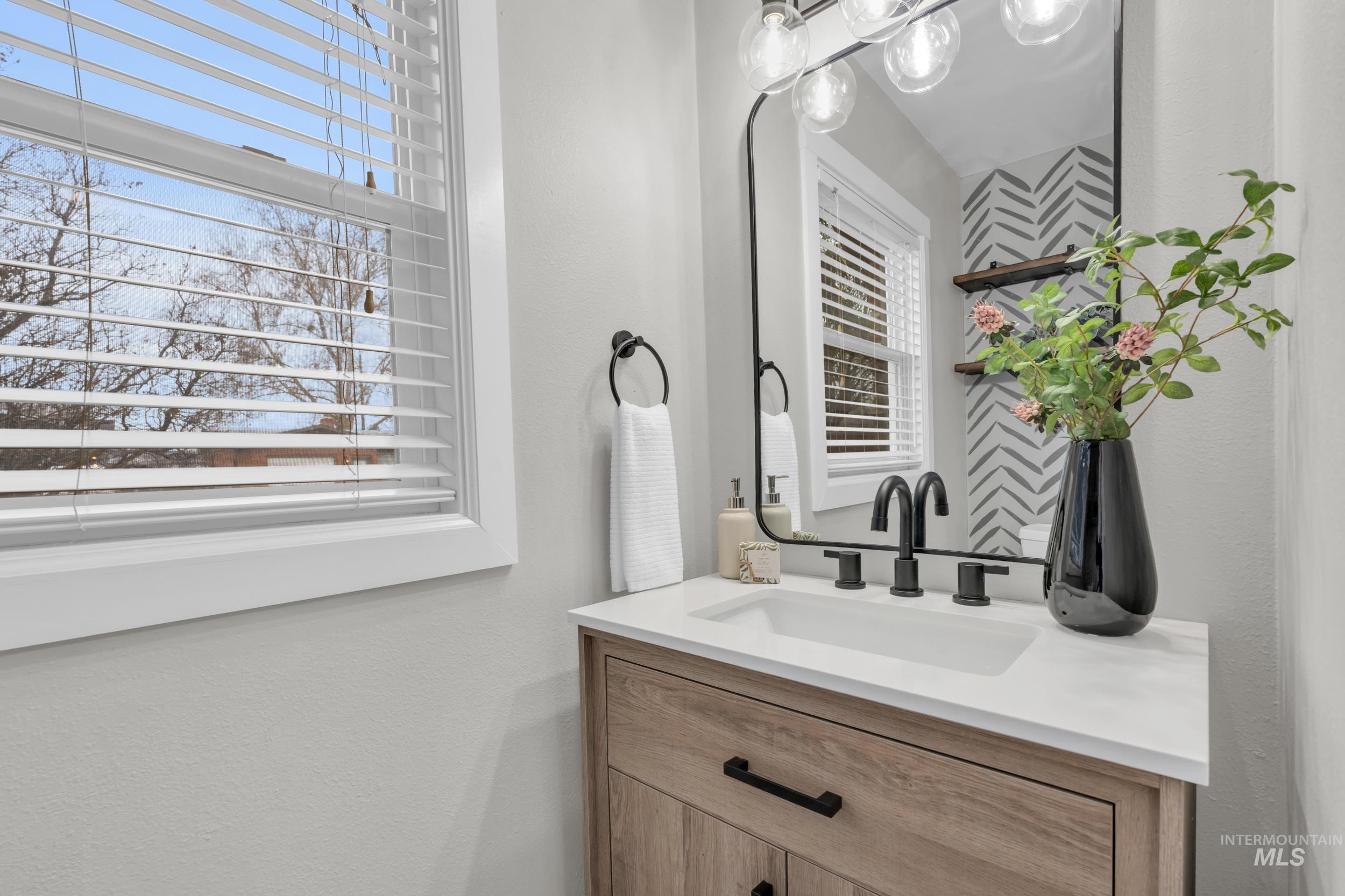 2908 Meadowbrook Drive Boise, ID 83705 - Photo 22 of 29 Bathroom featuring vanity and a textured wall