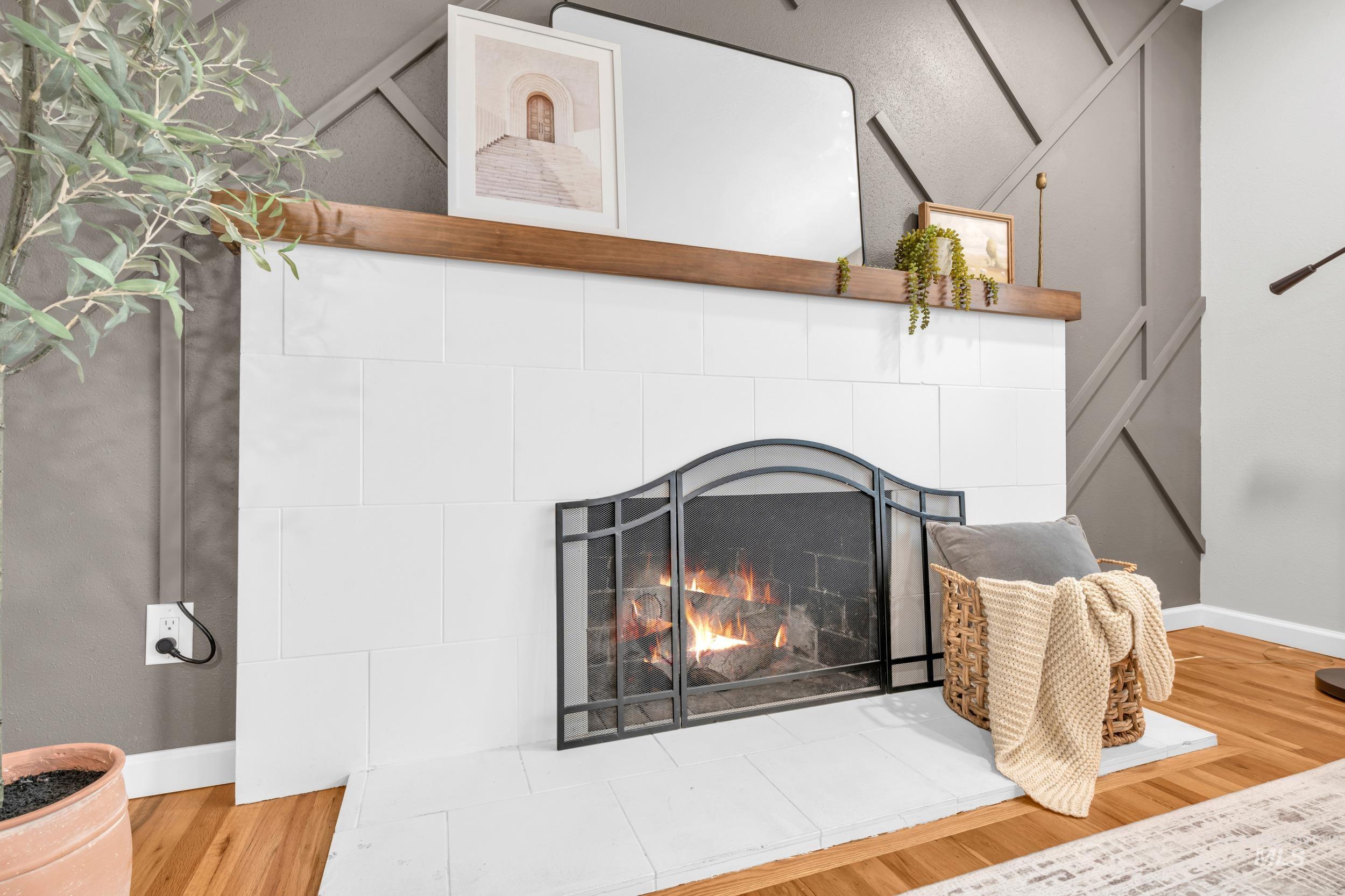 2908 Meadowbrook Drive Boise, ID 83705 - Photo 9 of 29 Detailed view of wood finished floors and a tiled fireplace
