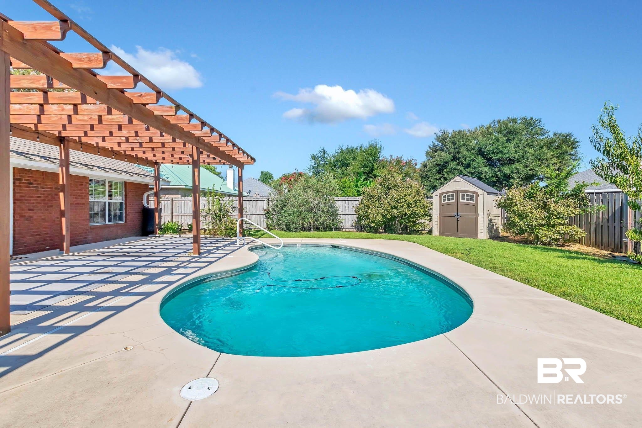 9607 Czar Court Fairhope, AL 36532 - Photo 3 of 42 View of pool featuring a pergola, a fenced backyard, a shed, and a patio