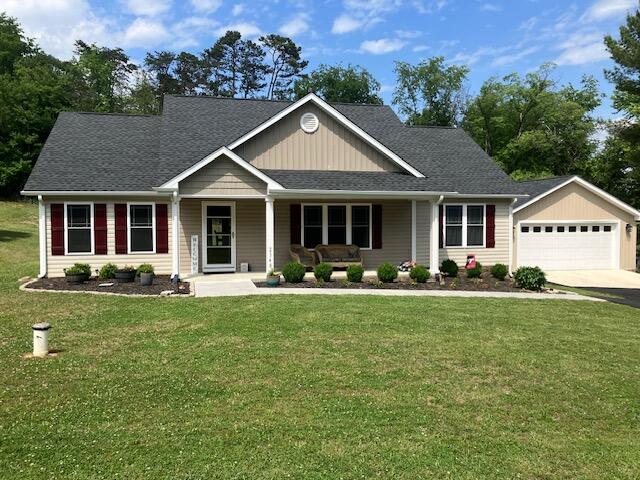 2348 East Ruritan Road Roanoke, VA 24012 - Photo 1 of 31 a front view of a house with a yard and garage