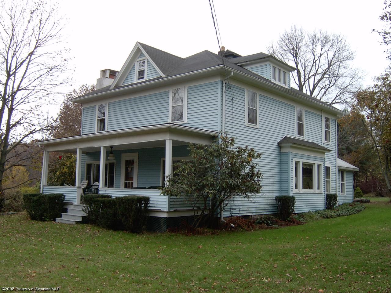 304 Lane Hill Road Tunkhannock, PA 18657 - Photo 1 of 4 a front view of house with yard and green space