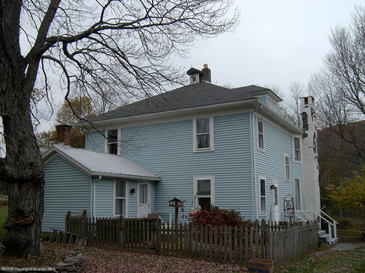 304 Lane Hill Road Tunkhannock, PA 18657 - Photo 4 of 4 a front view of house with yard and trees