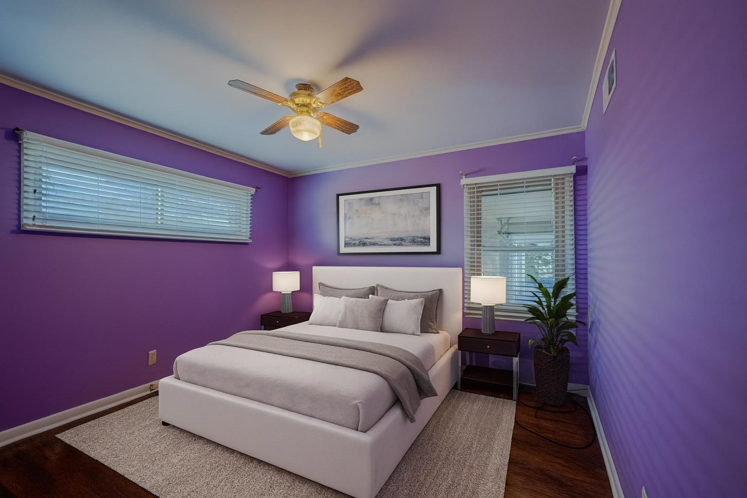 248 North Yates Road Memphis, TN 38120 - Photo 16 of 40 a bedroom with a bed and a potted plant