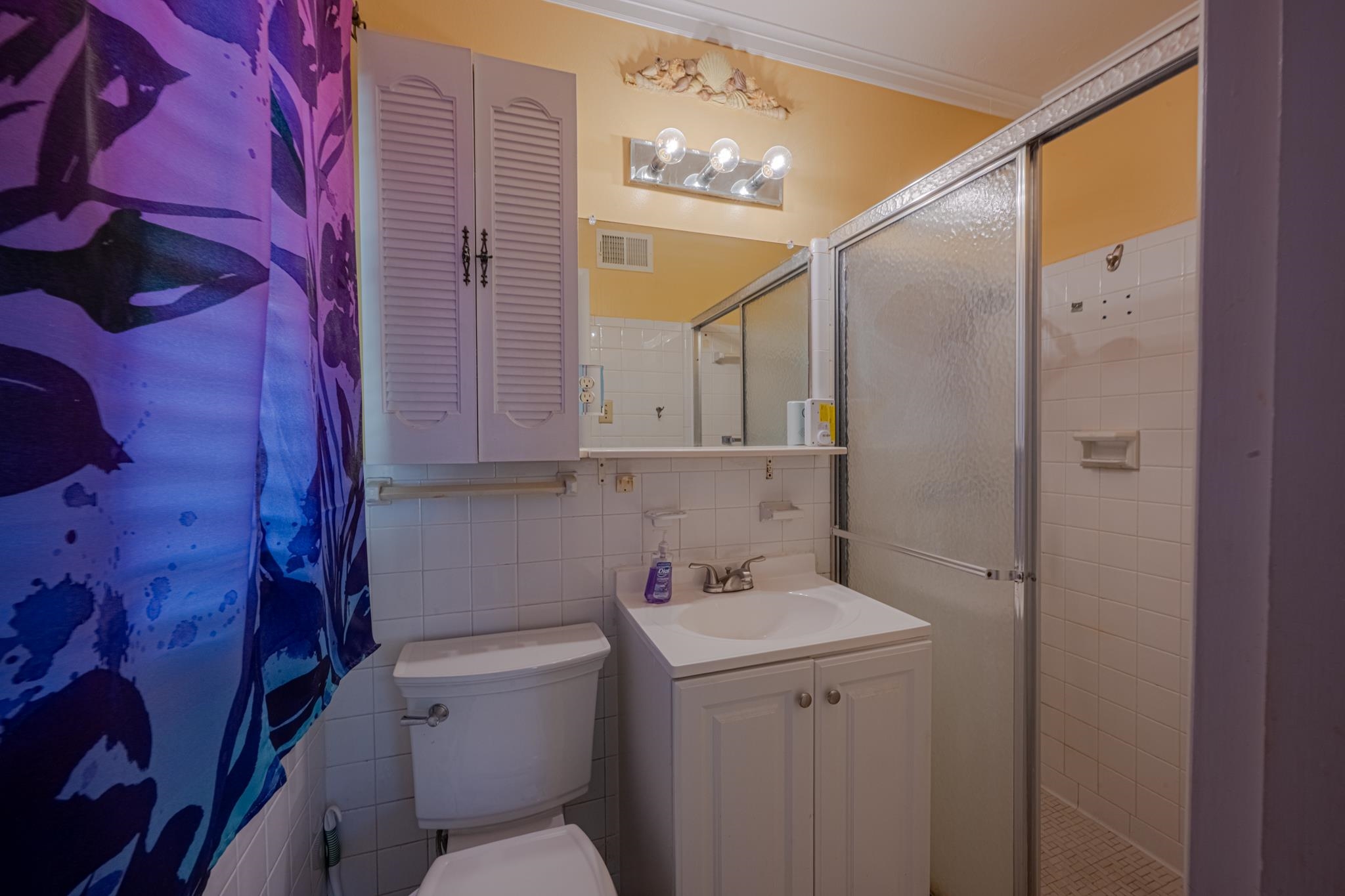 248 North Yates Road Memphis, TN 38120 - Photo 22 of 40 a bathroom with a sink a toilet and shower
