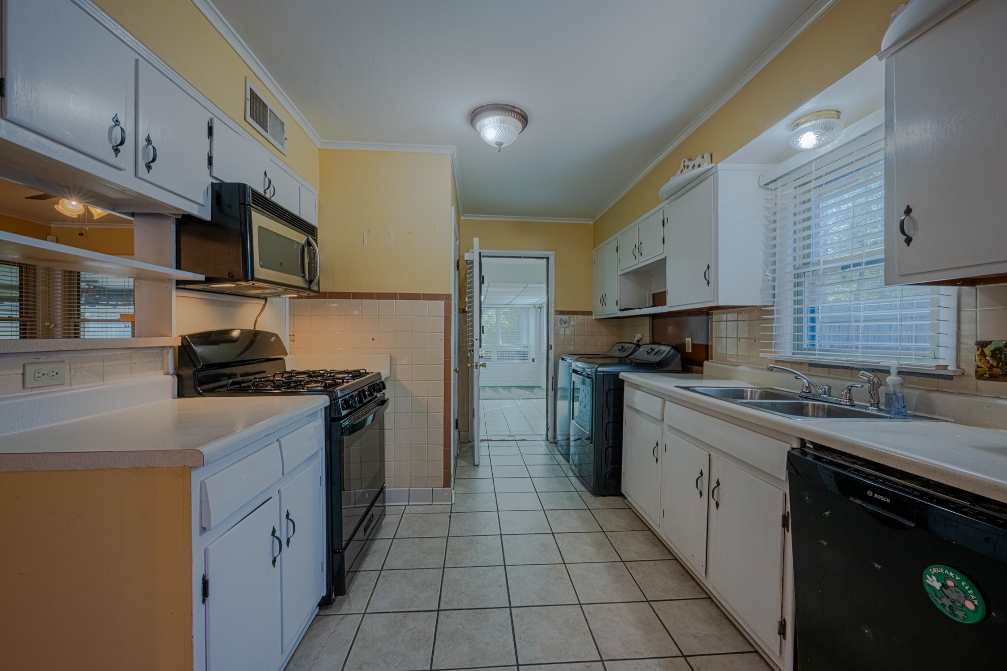 248 North Yates Road Memphis, TN 38120 - Photo 24 of 40 a kitchen with stainless steel appliances granite countertop a stove a sink and a refrigerator