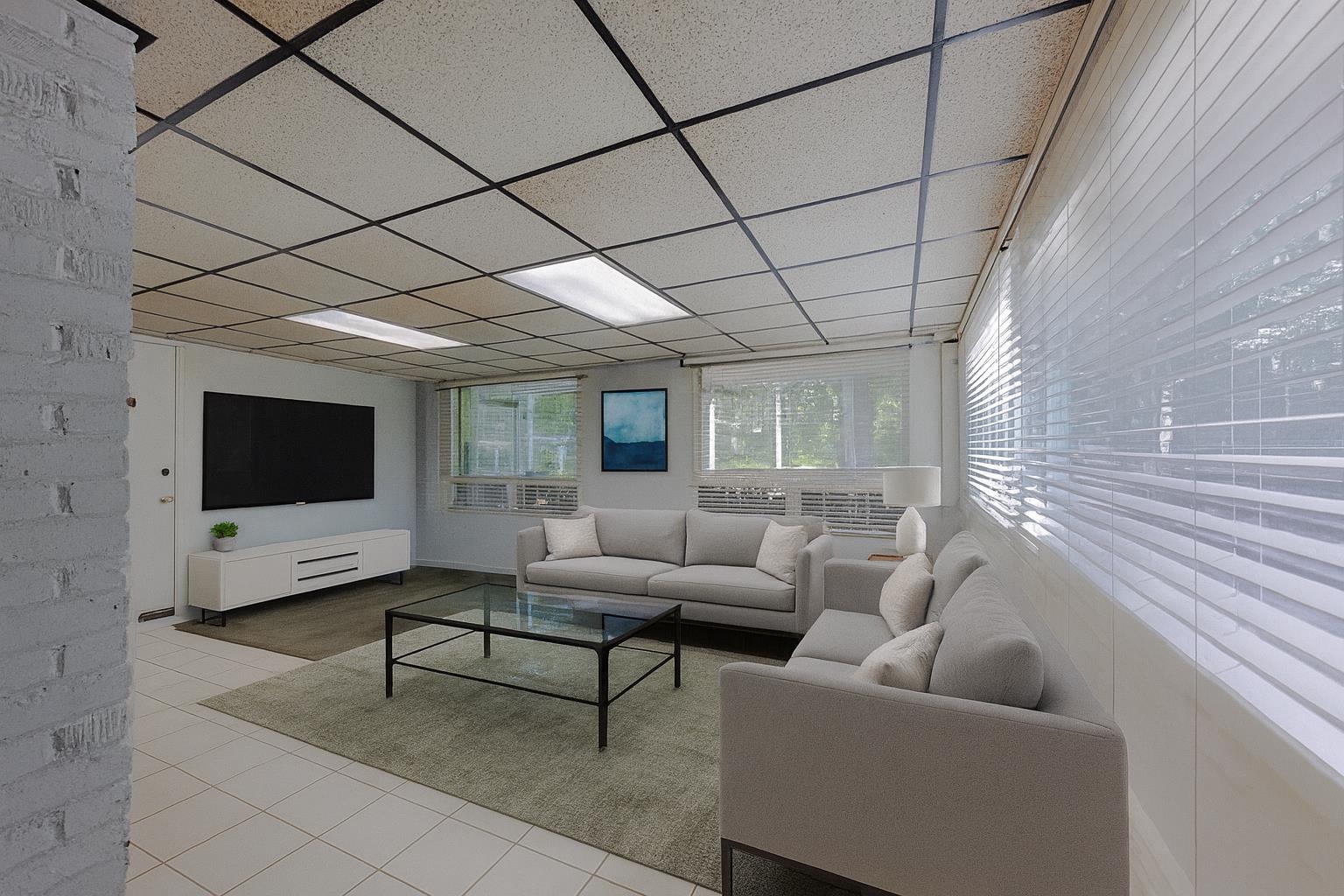248 North Yates Road Memphis, TN 38120 - Photo 25 of 40 a living room with furniture and a flat screen tv