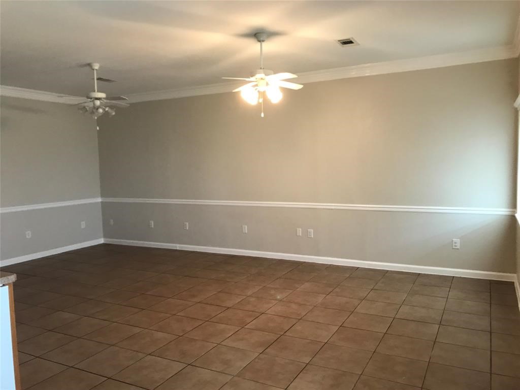6500 South Fm 565 Rd Cove Cove, TX 77523 - Photo 5 of 8 wooden floor in an empty room