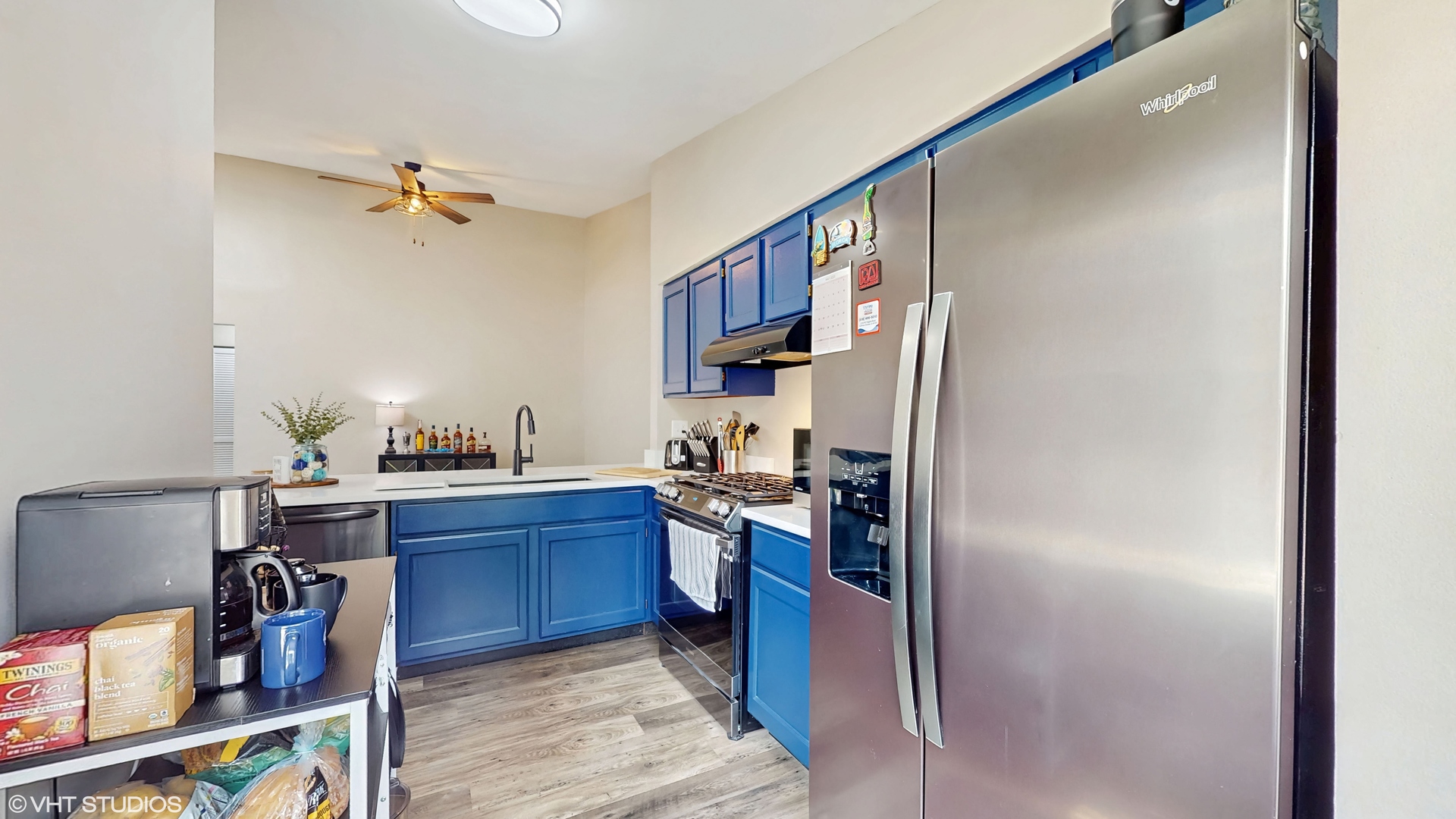 267 Juniper Circle Streamwood, IL 60107 - Photo 12 of 25 a kitchen with stainless steel appliances granite countertop a refrigerator and wooden cabinets