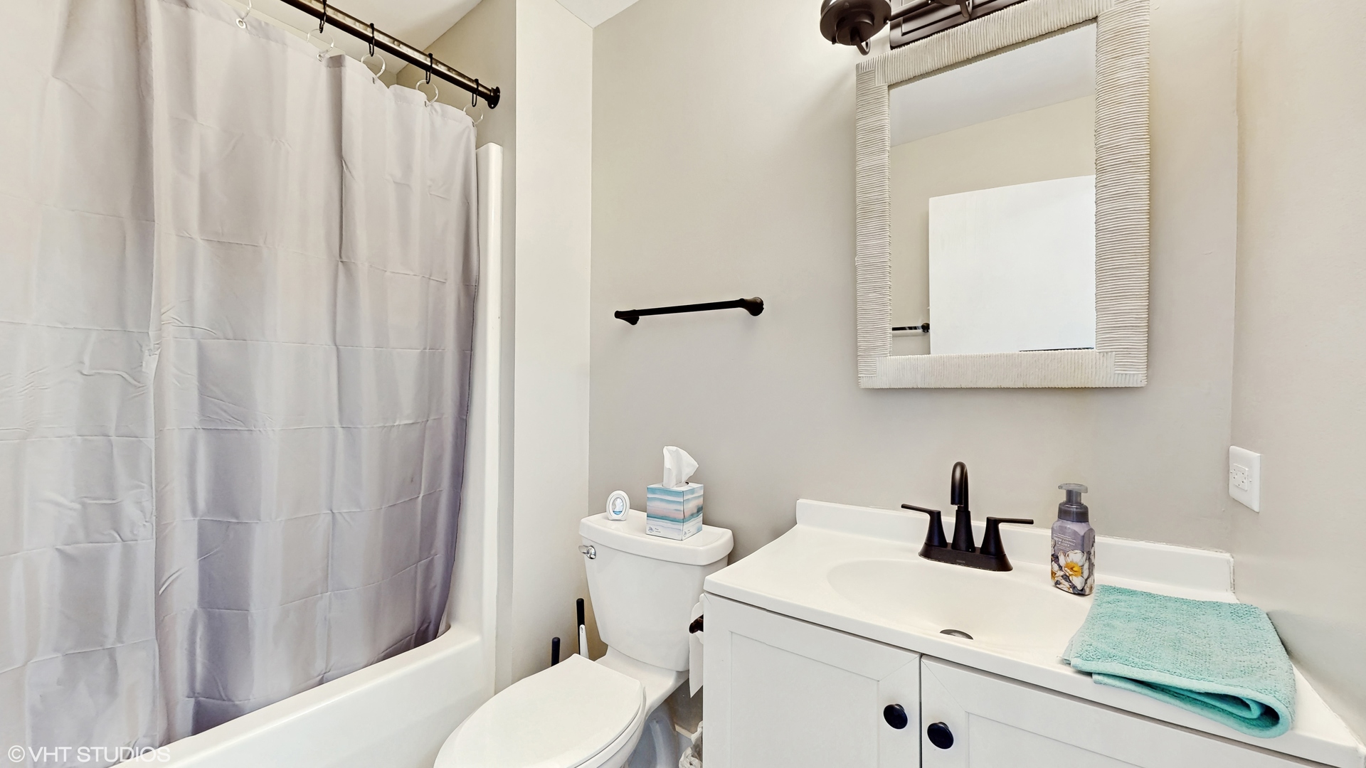 267 Juniper Circle Streamwood, IL 60107 - Photo 20 of 25 a bathroom with a sink a toilet and shower curtain
