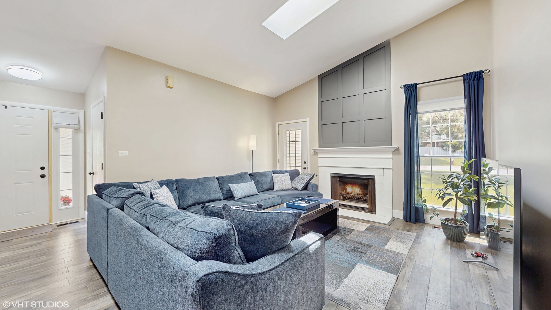 267 Juniper Circle Streamwood, IL 60107 - Photo 4 of 25 a living room with furniture a fireplace and a potted plant