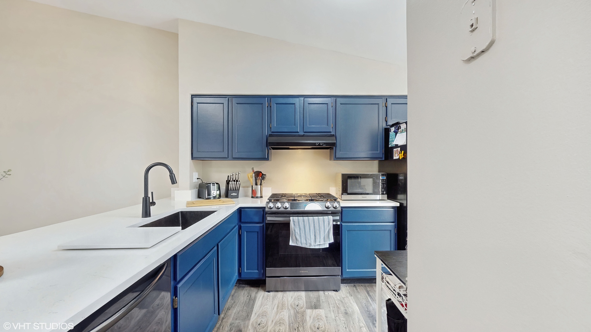 267 Juniper Circle Streamwood, IL 60107 - Photo 10 of 25 a kitchen with stainless steel appliances granite countertop a sink stove and cabinets