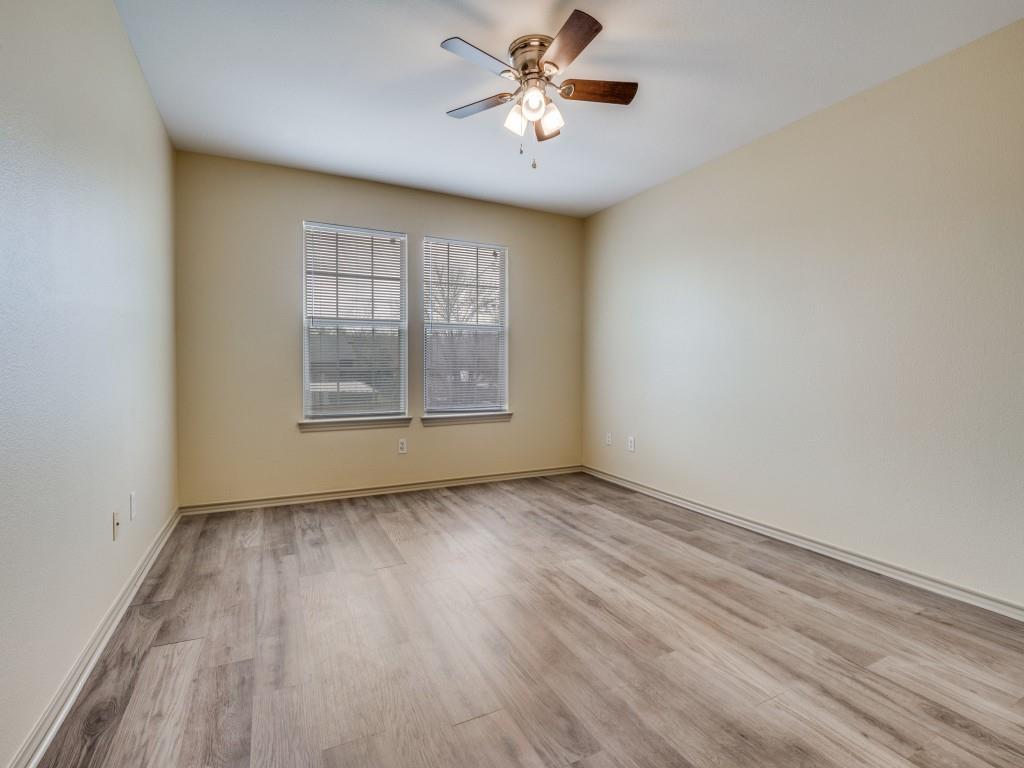 1439 North Bluegrove Road Lancaster, TX 75134 - Photo 9 of 12 wooden floor in an empty room with a window