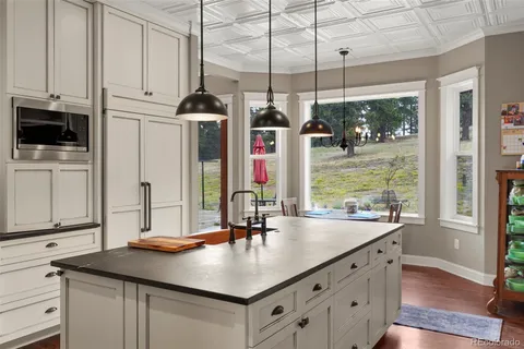 a kitchen with sink cabinets and window