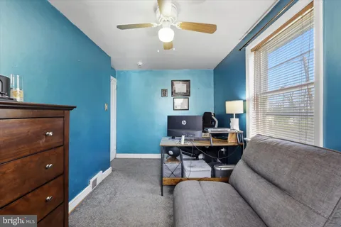 a workspace with furniture and a window