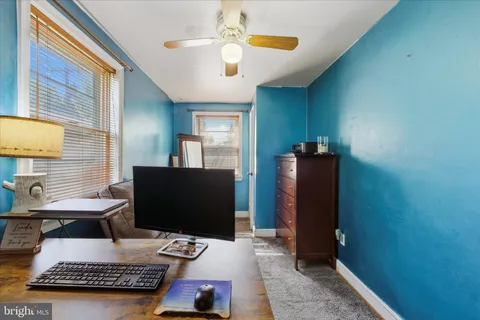 a workspace with furniture and window