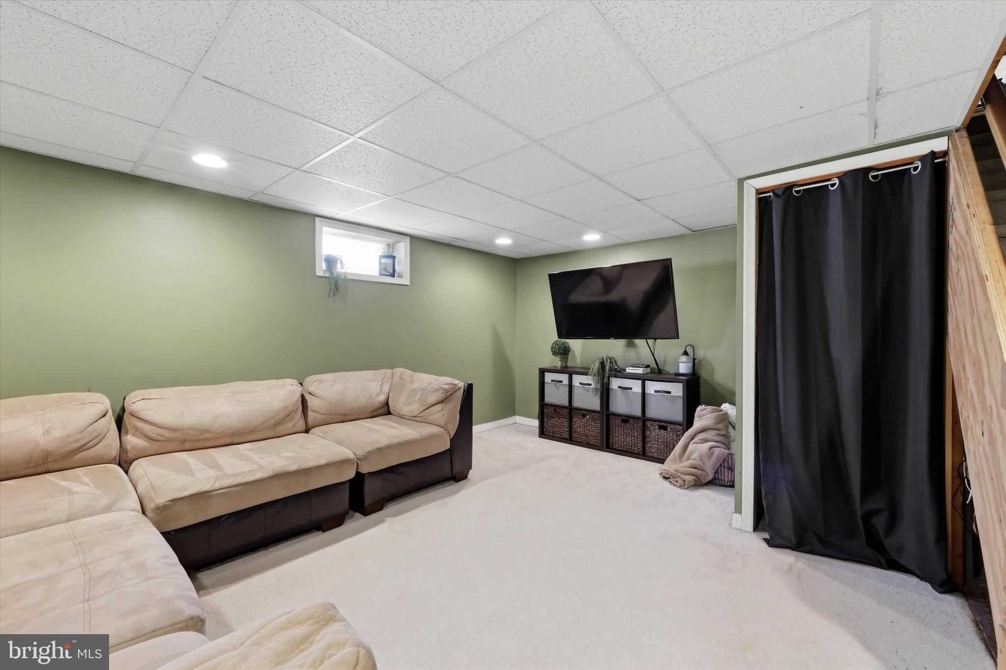 1801 Cricket Lane Folcroft, PA 19032 - Photo 18 of 22 a living room with furniture and a flat screen tv