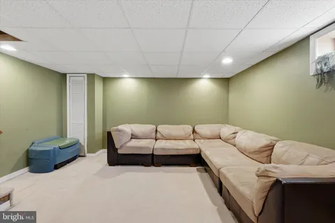 a living room with a couch and a flat screen tv