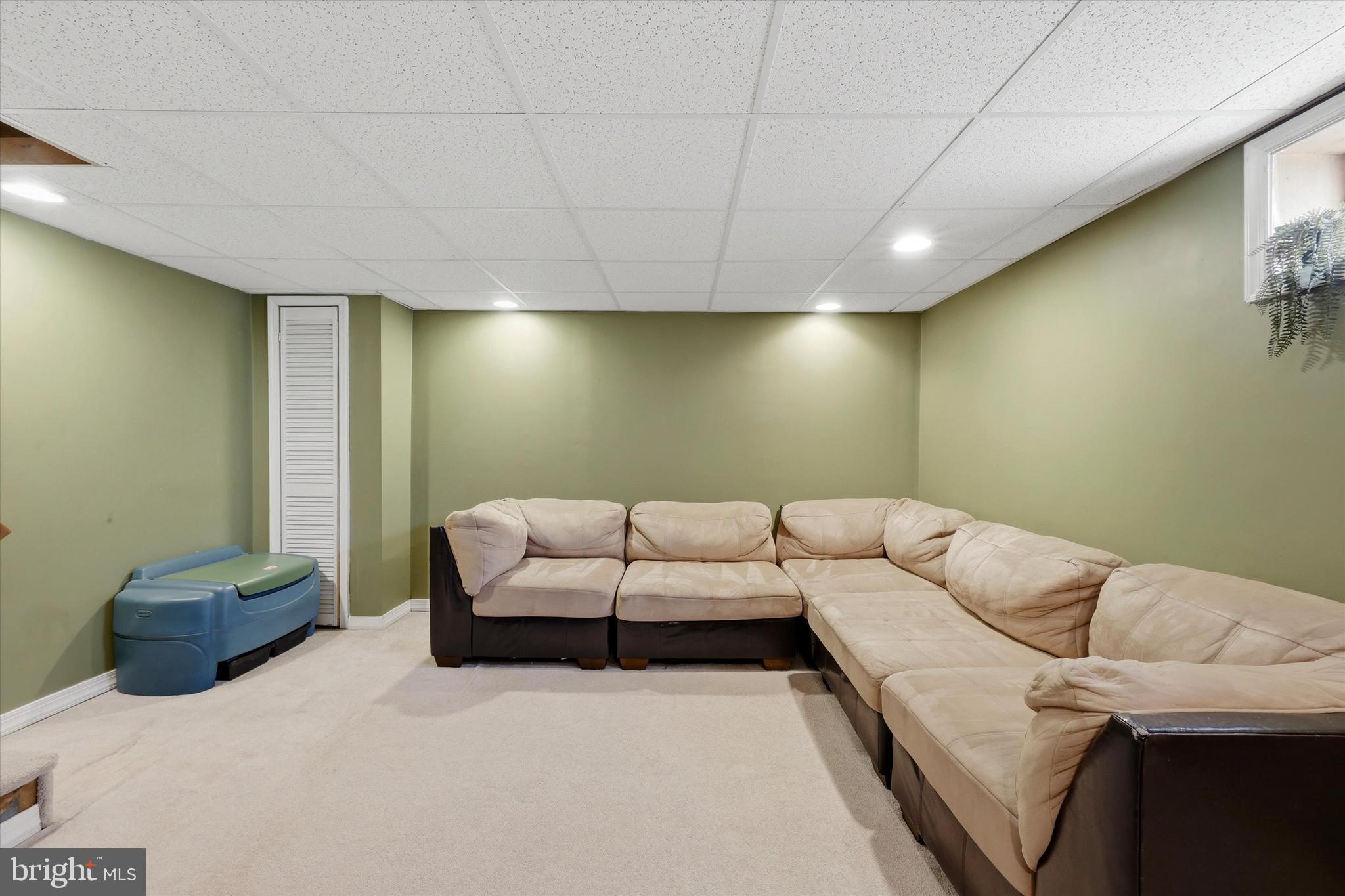 1801 Cricket Lane Folcroft, PA 19032 - Photo 19 of 22 a living room with a couch and a flat screen tv