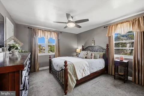 a bedroom with a bed and a table