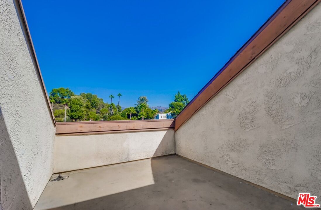 6171 Rancho Mission Road, Unit 317 San Diego, CA 92108 - Photo 17 of 26 a view of balcony with green space