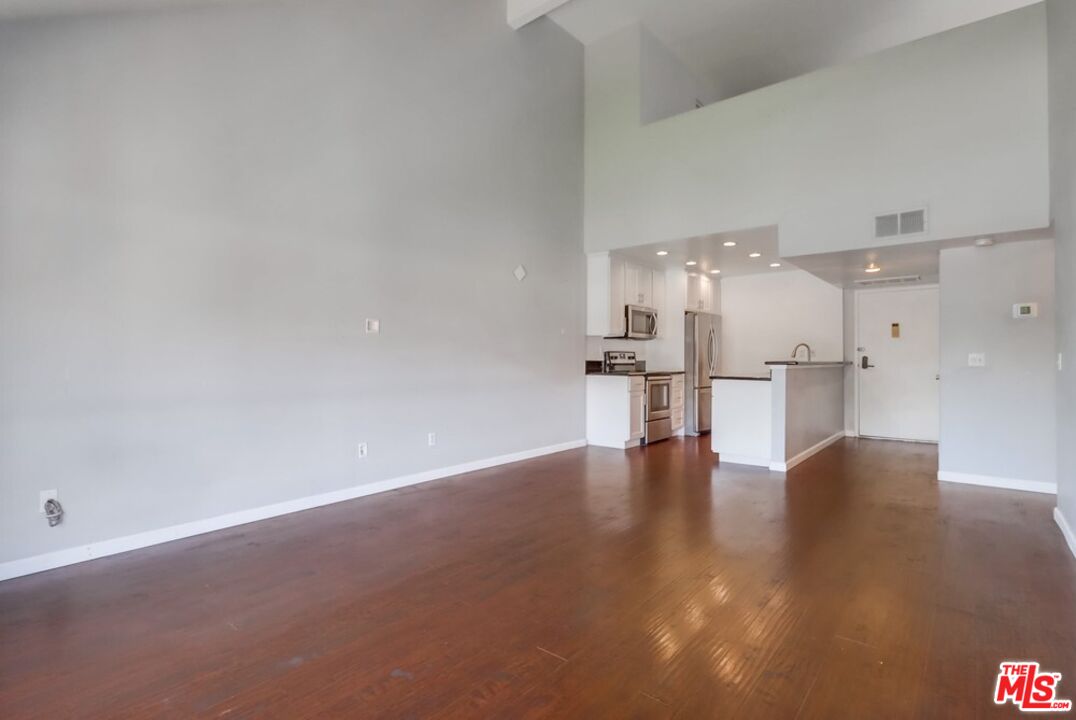 6171 Rancho Mission Road, Unit 317 San Diego, CA 92108 - Photo 4 of 26 a view of empty room with wooden floor