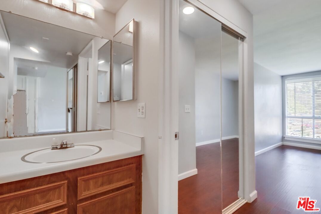6171 Rancho Mission Road, Unit 317 San Diego, CA 92108 - Photo 9 of 26 a bathroom with a sink and a mirror