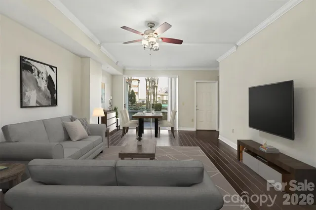 a living room with furniture and a flat screen tv