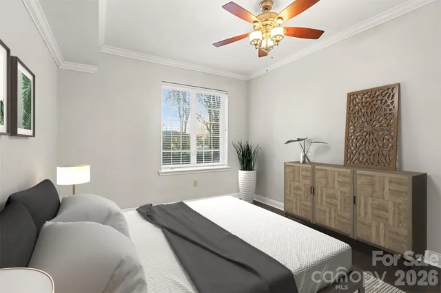 a bedroom with a bed dresser and a window