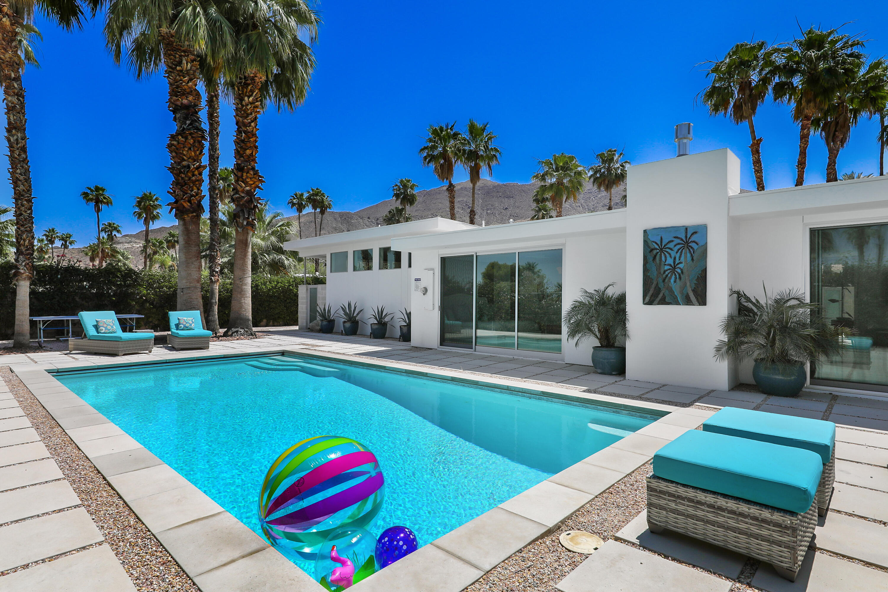 71390 Gardess Road Rancho Mirage, CA 92270 - Photo 1 of 54 a view of swimming pool with a table and chairs
