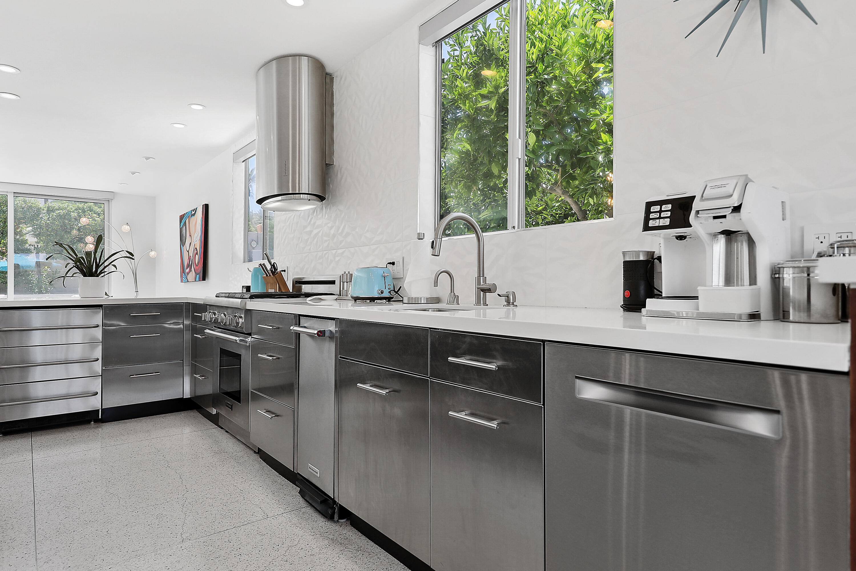 71390 Gardess Road Rancho Mirage, CA 92270 - Photo 21 of 54 a kitchen with stainless steel appliances a sink stove and cabinets