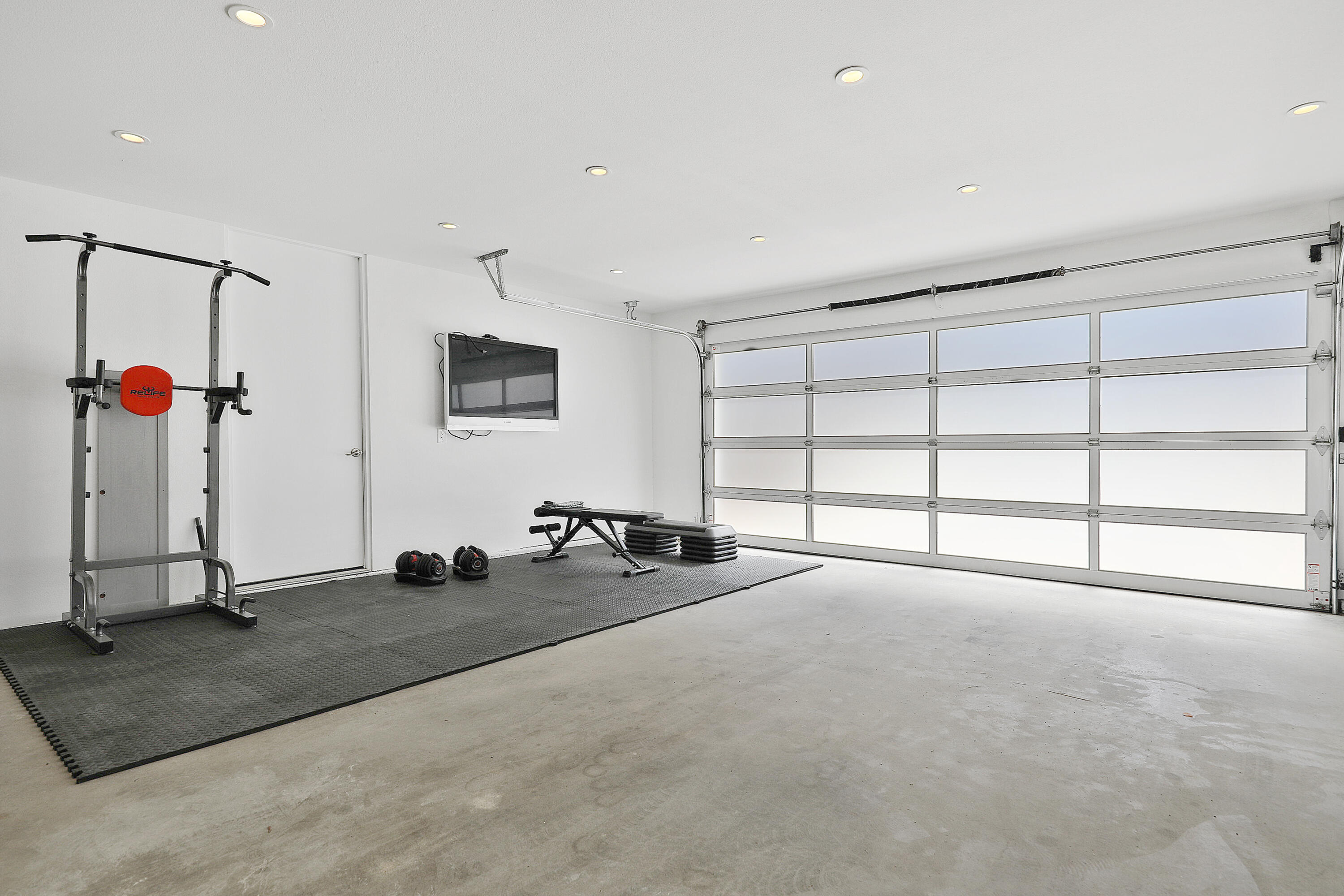 71390 Gardess Road Rancho Mirage, CA 92270 - Photo 46 of 54 a view of a room with gym equipment and a large window