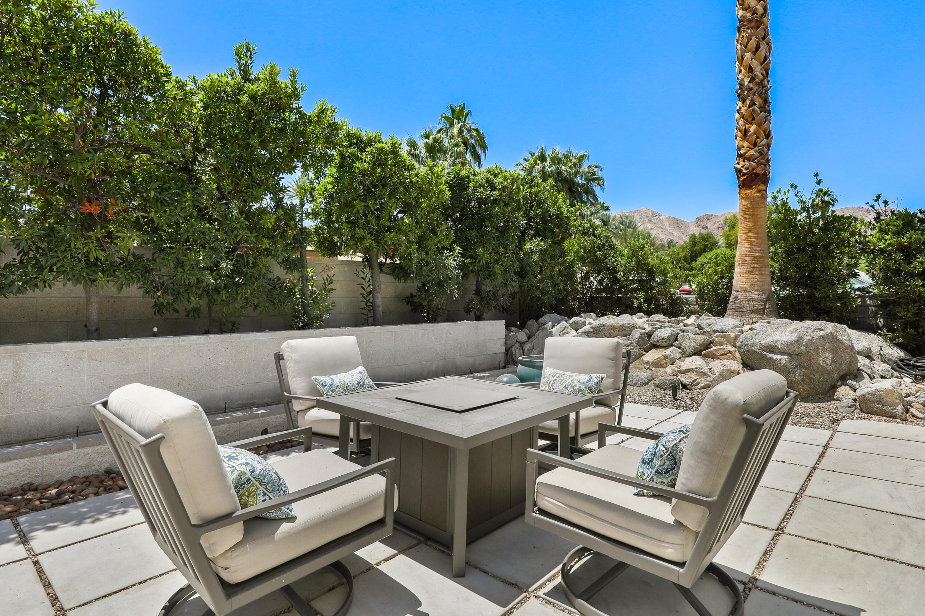 71390 Gardess Road Rancho Mirage, CA 92270 - Photo 6 of 54 a view of a patio with chairs and a table