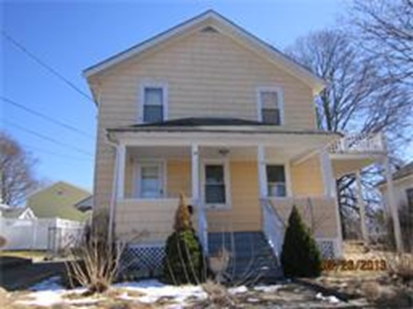 22 Riverside Avenue Gloucester, MA 01930 - Photo 1 of 13 a front view of a house with garden
