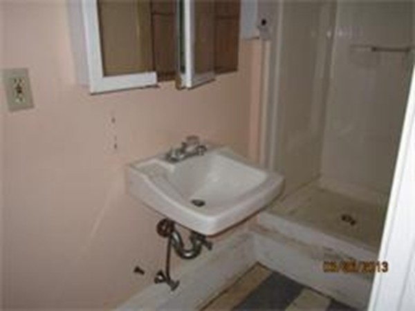 22 Riverside Avenue Gloucester, MA 01930 - Photo 12 of 13 a bathroom with a sink and mirror