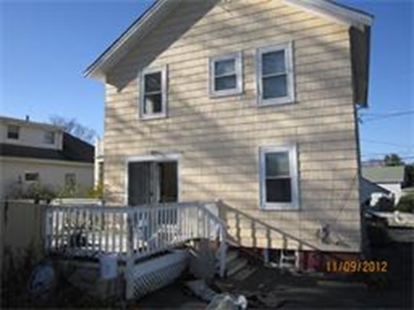 22 Riverside Avenue Gloucester, MA 01930 - Photo 2 of 13 a front view of a house with balcony