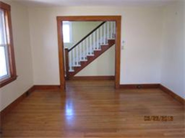 22 Riverside Avenue Gloucester, MA 01930 - Photo 5 of 13 a view of an entryway with wooden floor