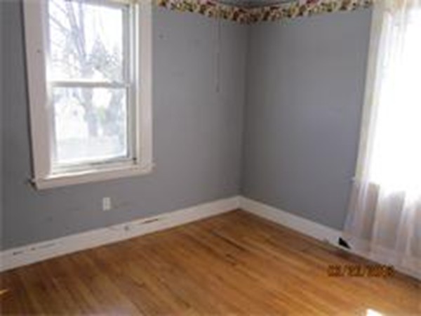 22 Riverside Avenue Gloucester, MA 01930 - Photo 10 of 13 a view of a room that has a window in it