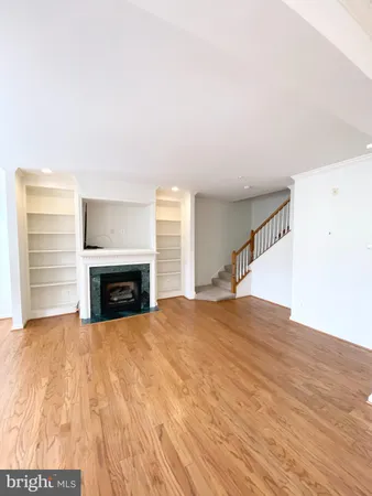 a view of kitchen with kitchen island microwave and stove