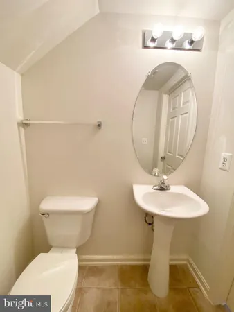 a kitchen with stainless steel appliances granite countertop a stove a microwave and a white cabinets