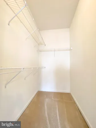 a bathroom with a toilet a sink and vanity