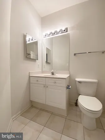 a bathroom with a granite countertop sink a mirror and a bathtub