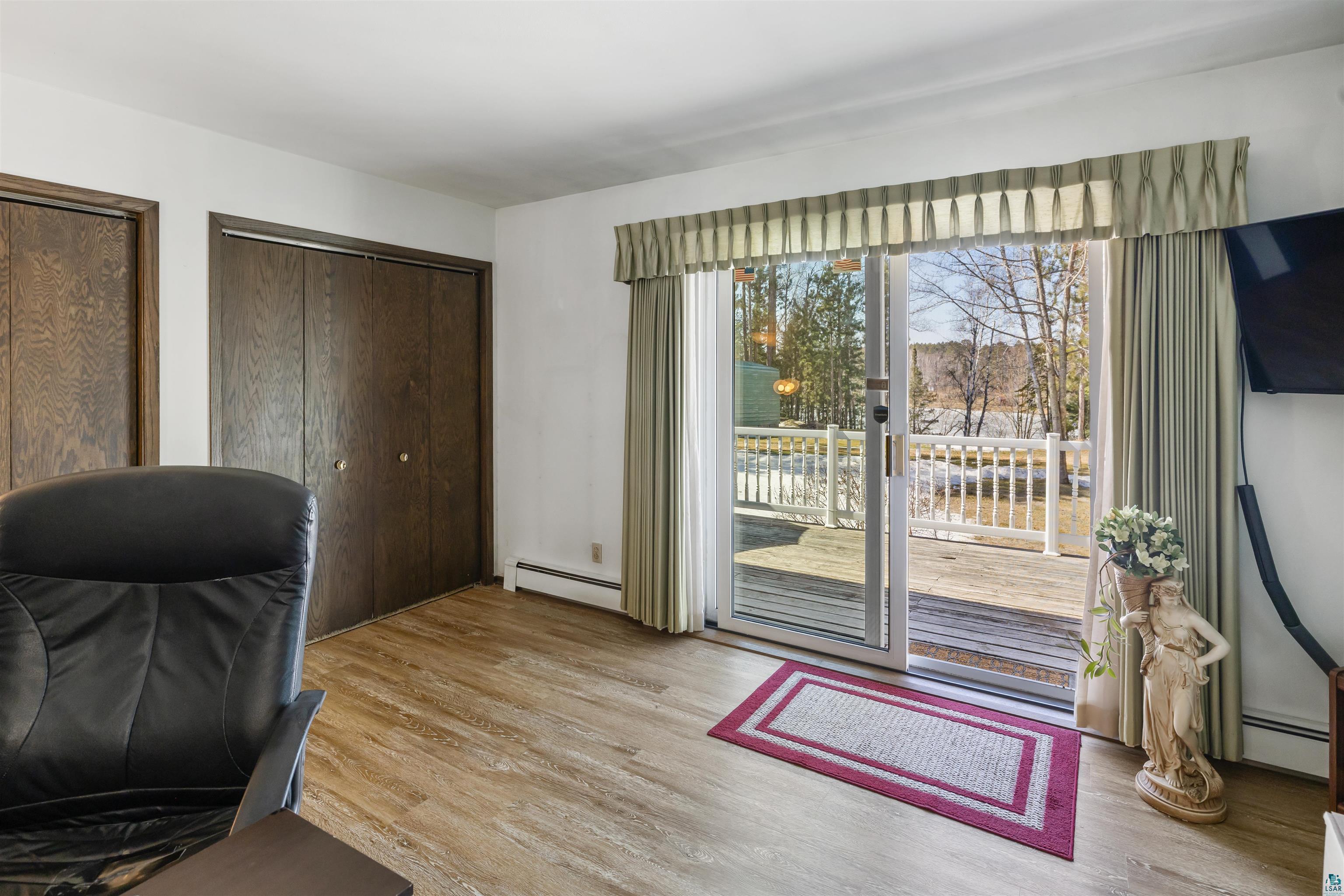 3975 Long Lake Shores Road Eveleth, MN 55734 - Photo 28 of 79 Office area with light wood-style floors and a baseboard heating unit