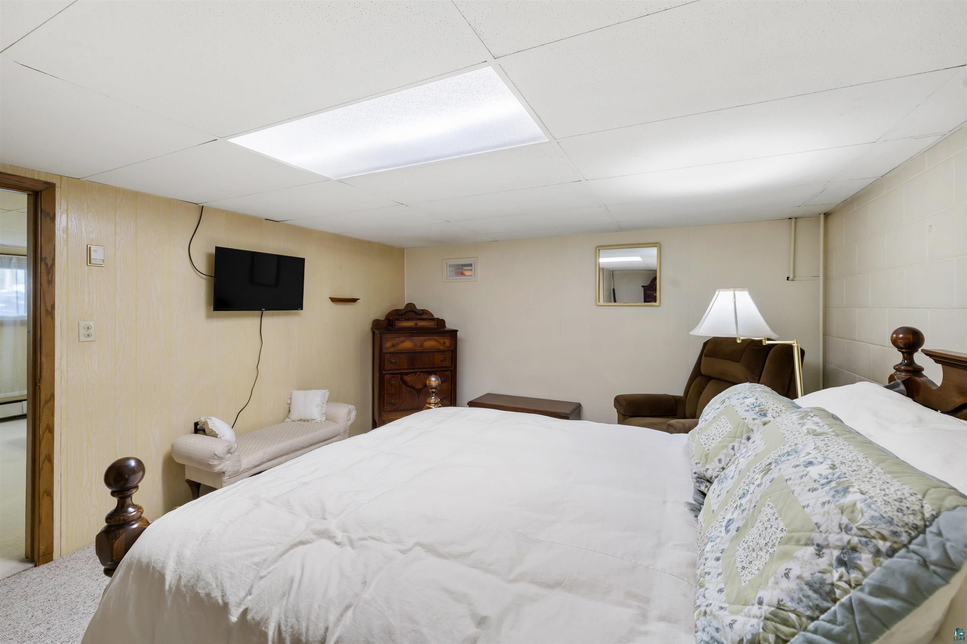 3975 Long Lake Shores Road Eveleth, MN 55734 - Photo 34 of 79 Carpeted bedroom featuring a paneled ceiling